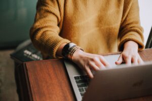 A woman in front of a laptop