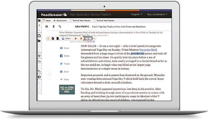 Laptop open with ReadSpeaker TextAid application.